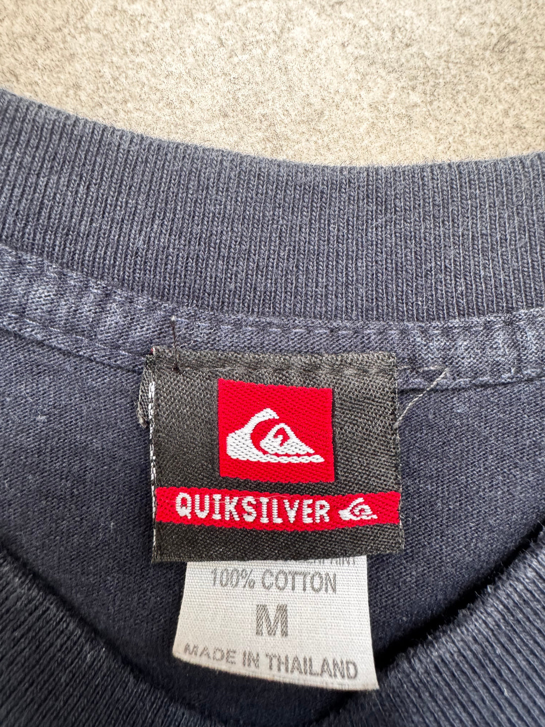Vintage Y2K Quiksilver T-shirt in navy, brand label detail
