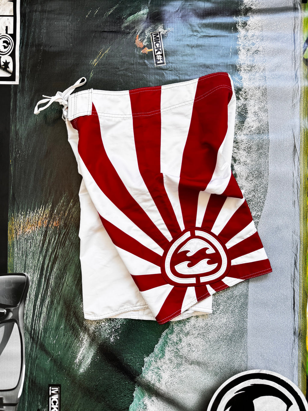 Vintage Y2K Billabong Andy Irons Rising Sun boardshorts in white and red, front view
