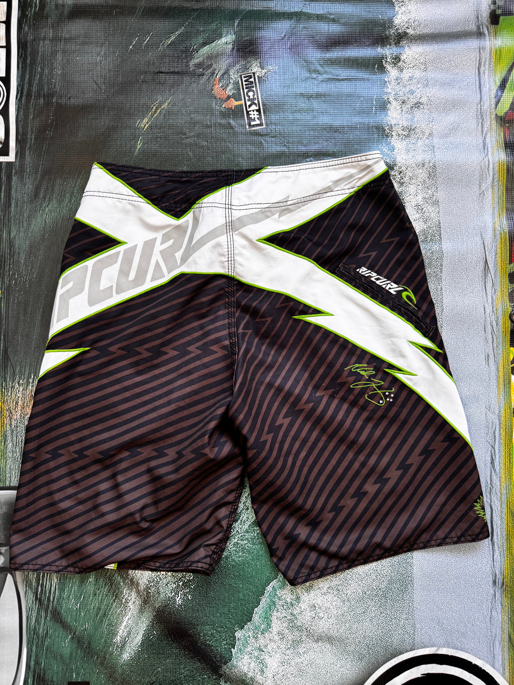 Vintage Y2K Rip Curl Mick Fanning boardshorts, print close-up