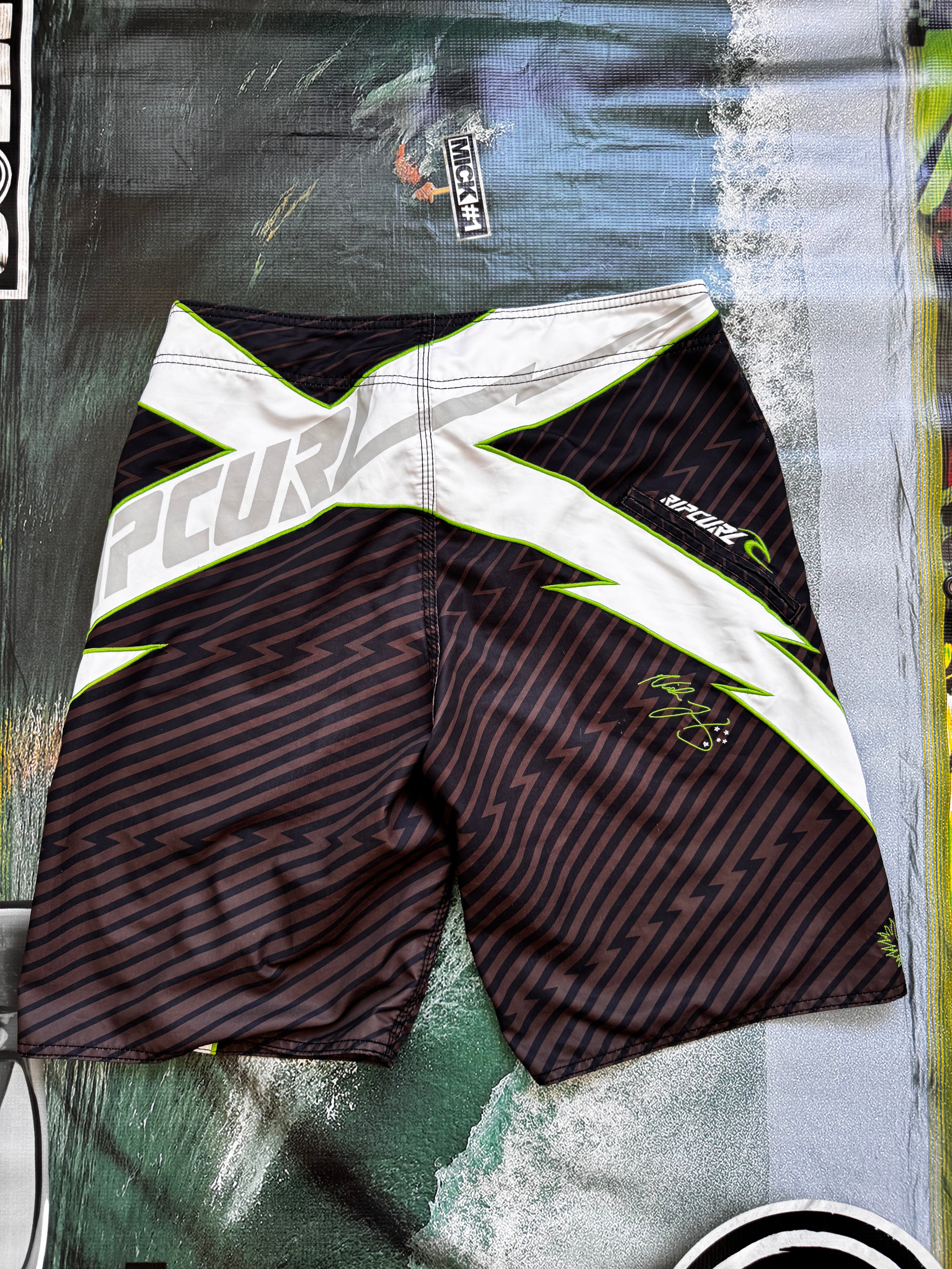 Vintage Y2K Rip Curl Mick Fanning boardshorts, print close-up