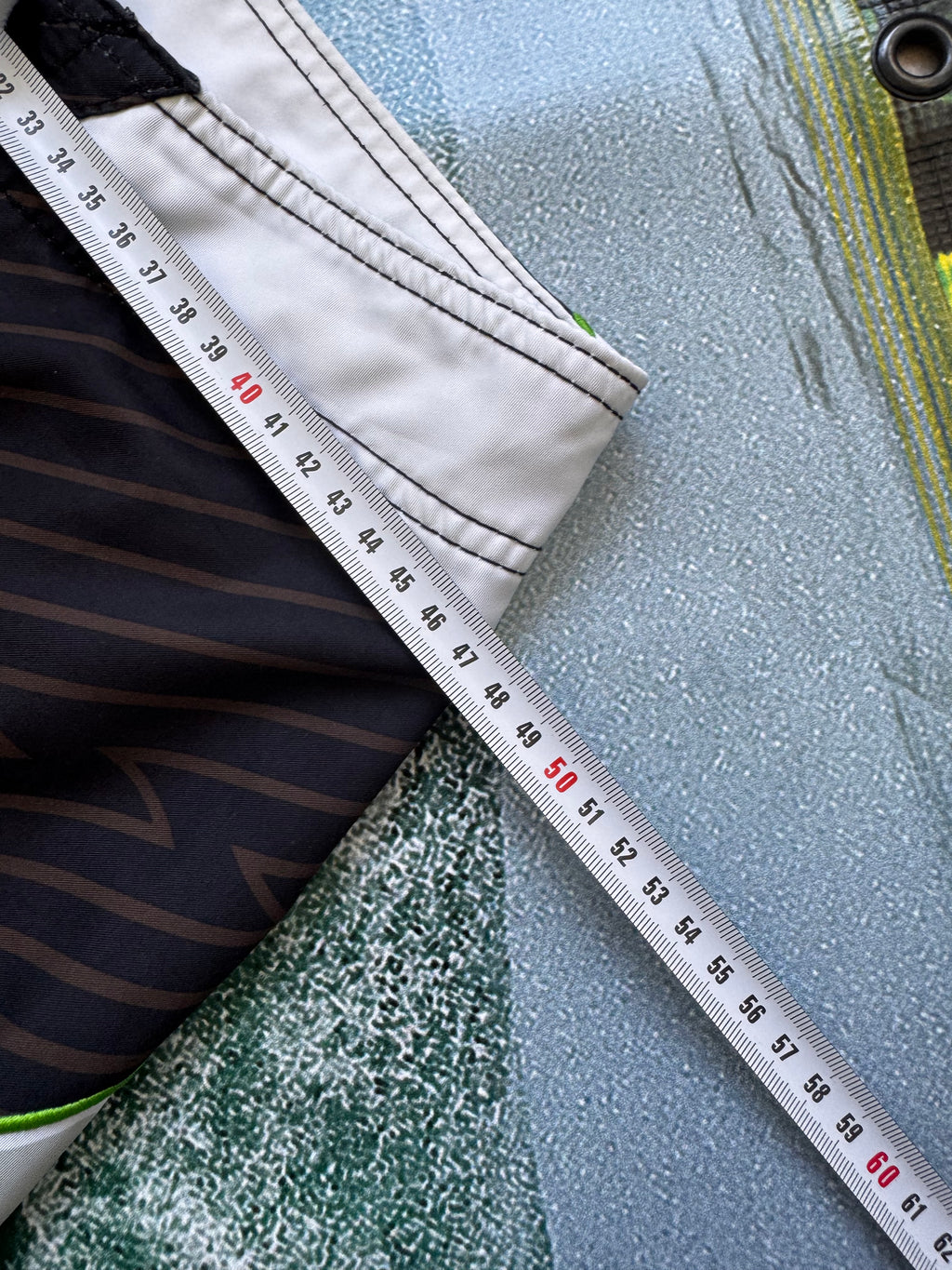 Vintage Y2K Rip Curl Mick Fanning boardshorts, flat lay