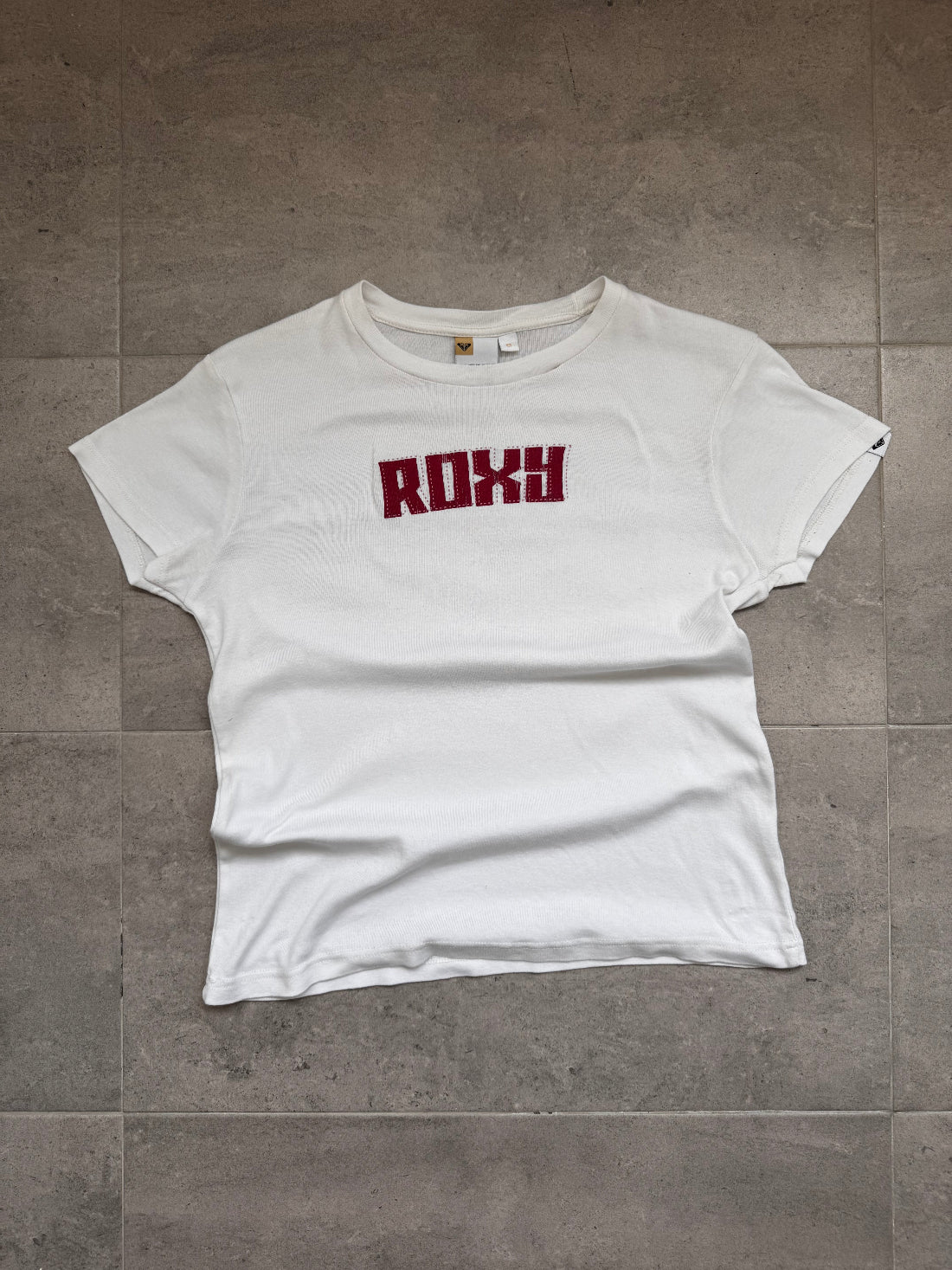 Vintage Y2K Roxy baby tee in white, front view