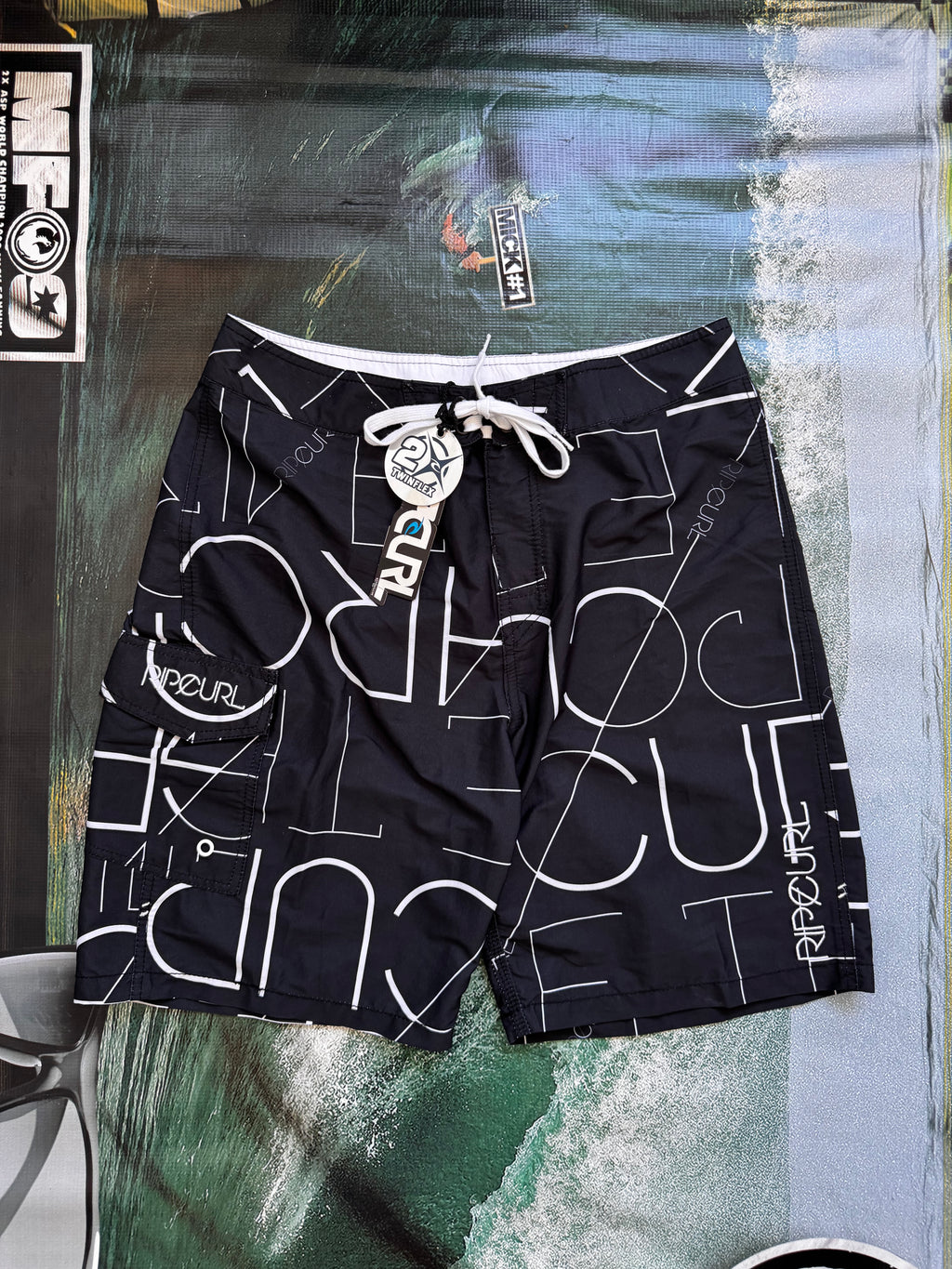 Vintage Y2K Rip Curl boardshorts in navy and white, front view