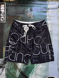 Vintage Y2K Rip Curl boardshorts in navy and white, front view