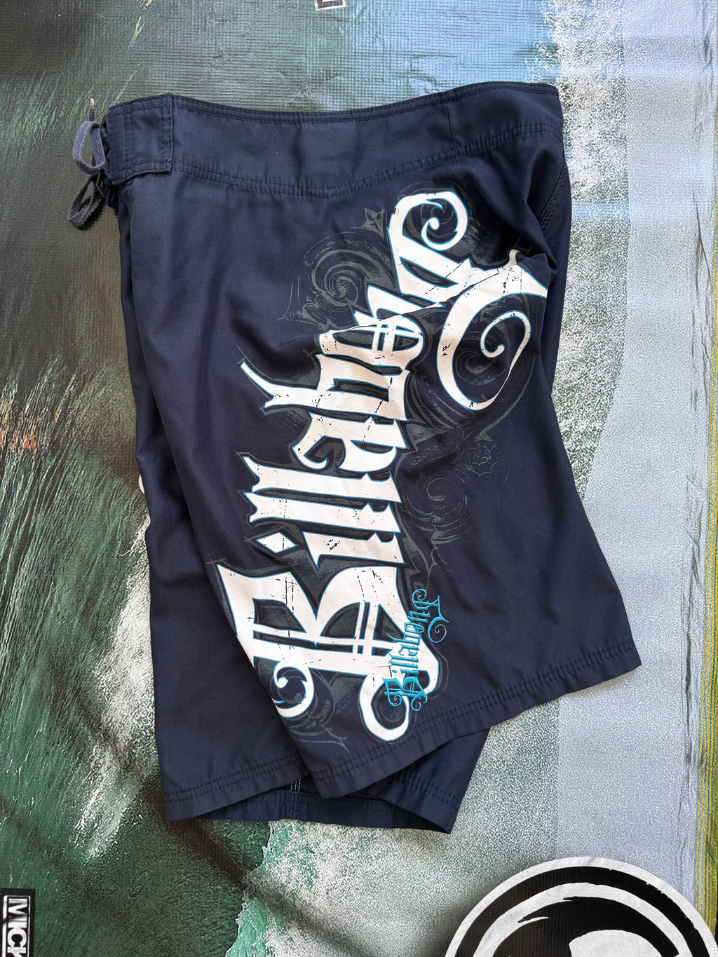 Vintage Y2K Billabong boardshorts in navy, front view