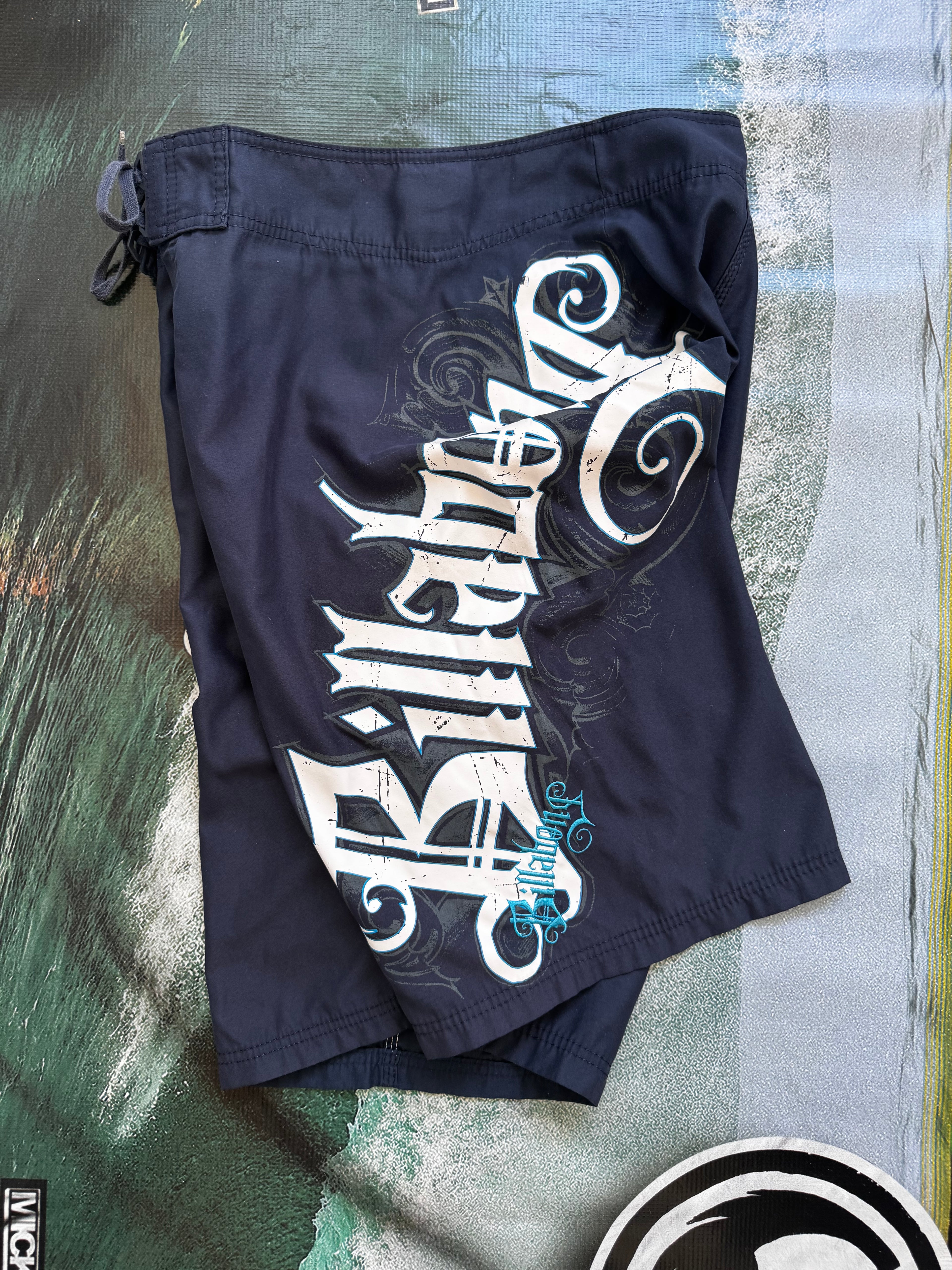 Vintage Y2K Billabong boardshorts in navy, front view