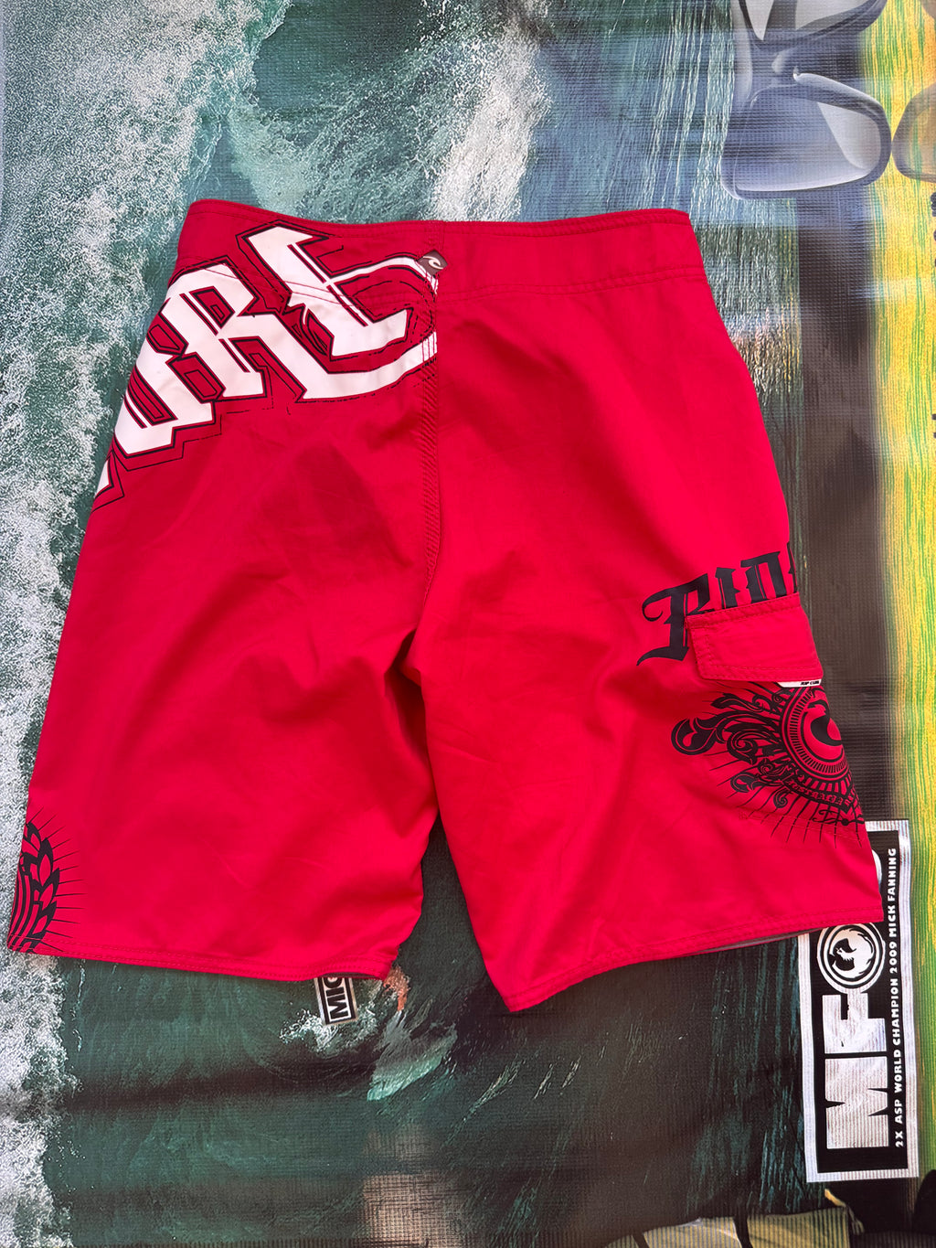 Y2K Rip Curl boardshorts in red, size 28, vintage surf shorts - detail view