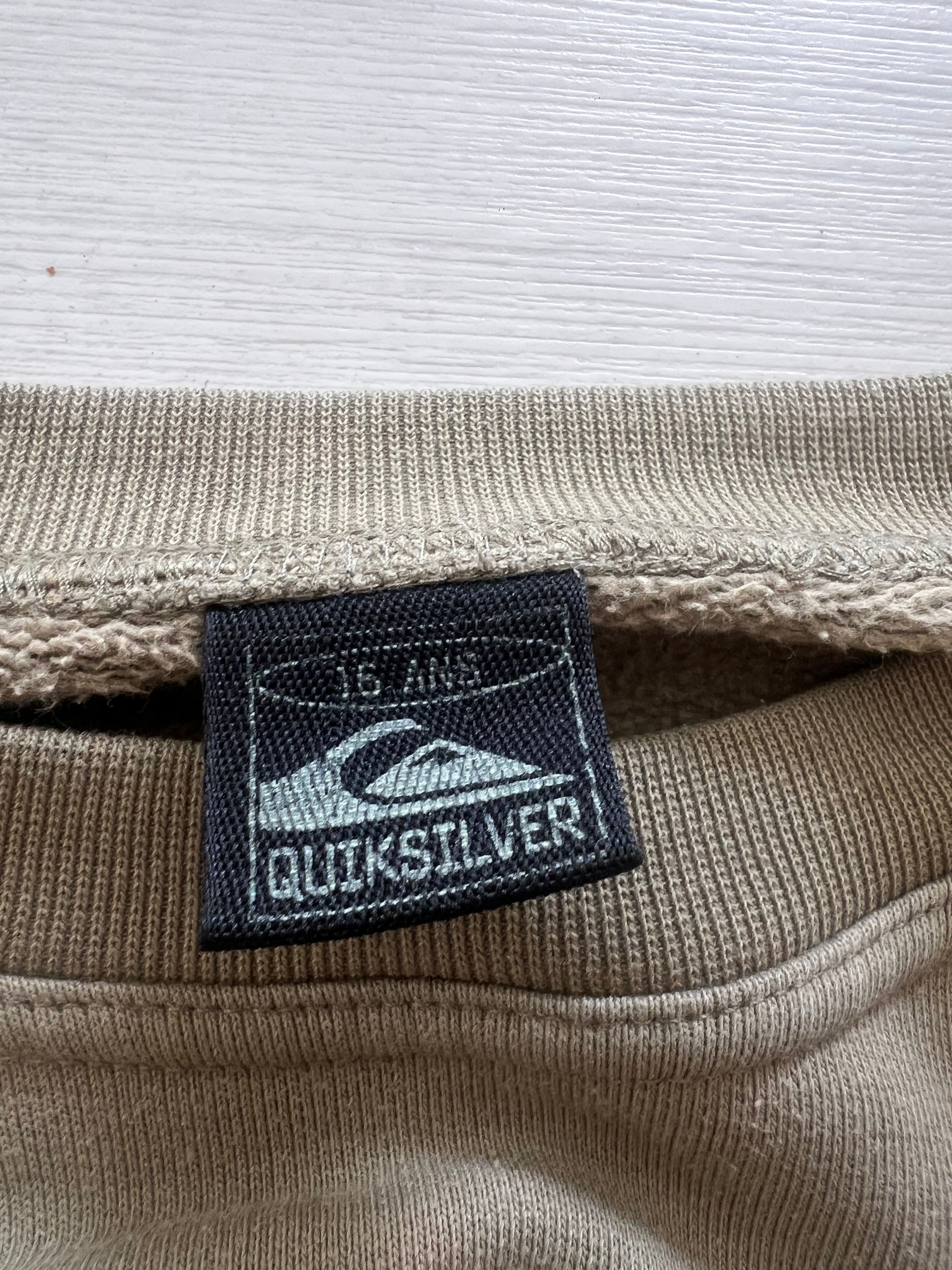 Vintage Quiksilver Kelly Slater sweatshirt detail — genuine vintage surf brand
