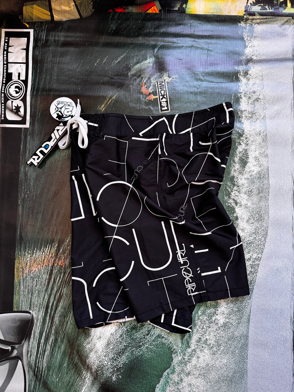 Vintage Y2K Rip Curl boardshorts in navy and white, back view