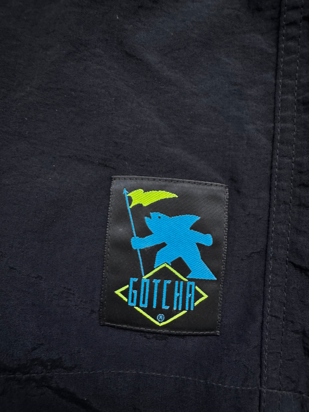 80s Gotcha deadstock boardshorts tag — original NWT vintage surfwear 1980s