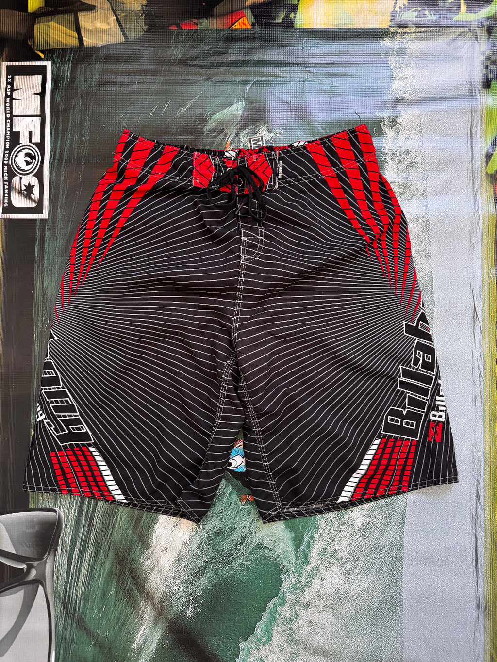 Vintage Y2K Billabong boardshorts in black and red, back view