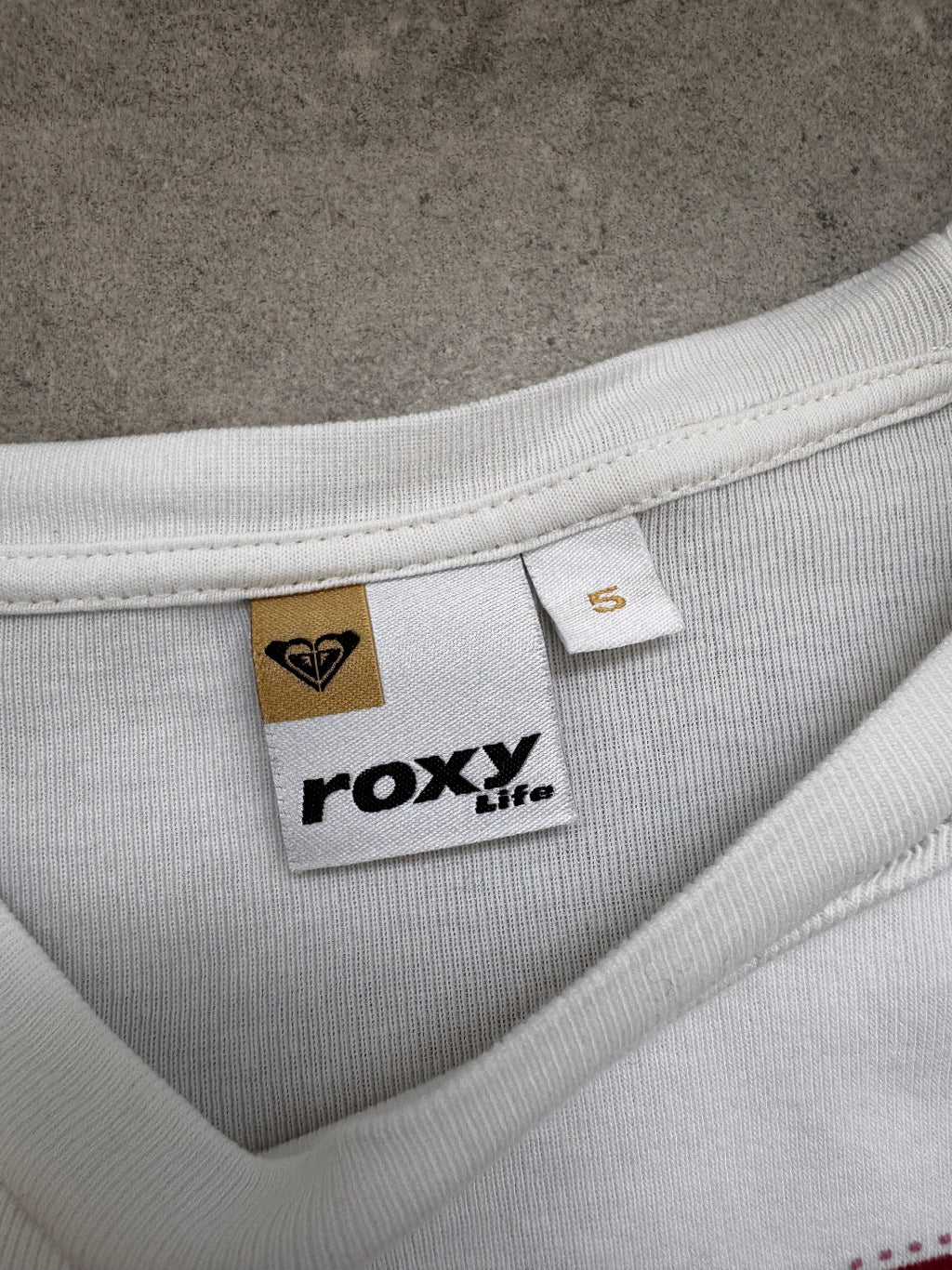 Vintage Y2K Roxy baby tee in white, brand label detail