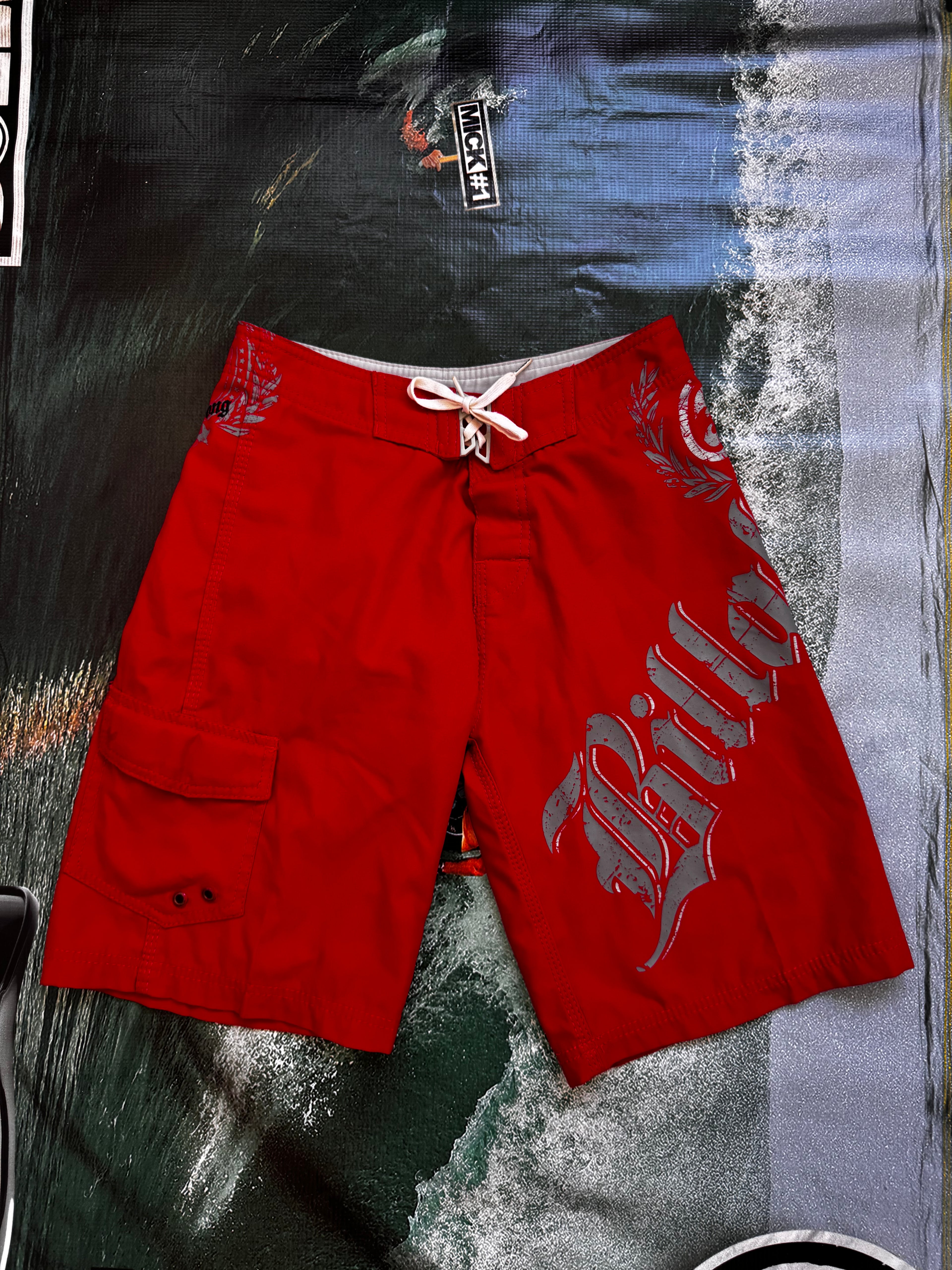 Vintage Y2K Billabong boardshorts in red, front view