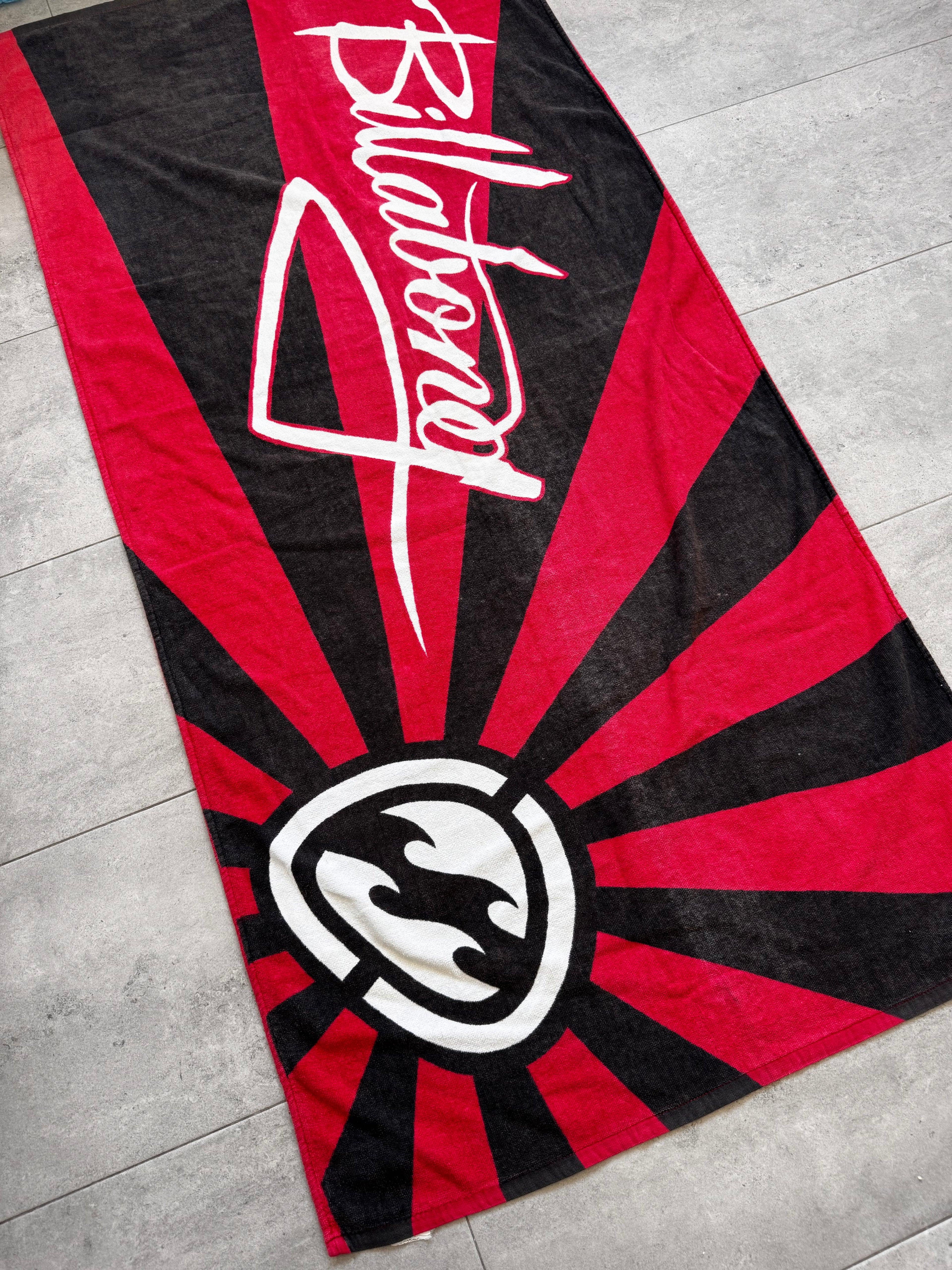 Vintage Y2K Billabong Rising Sun beach towel in red, black and white, full view