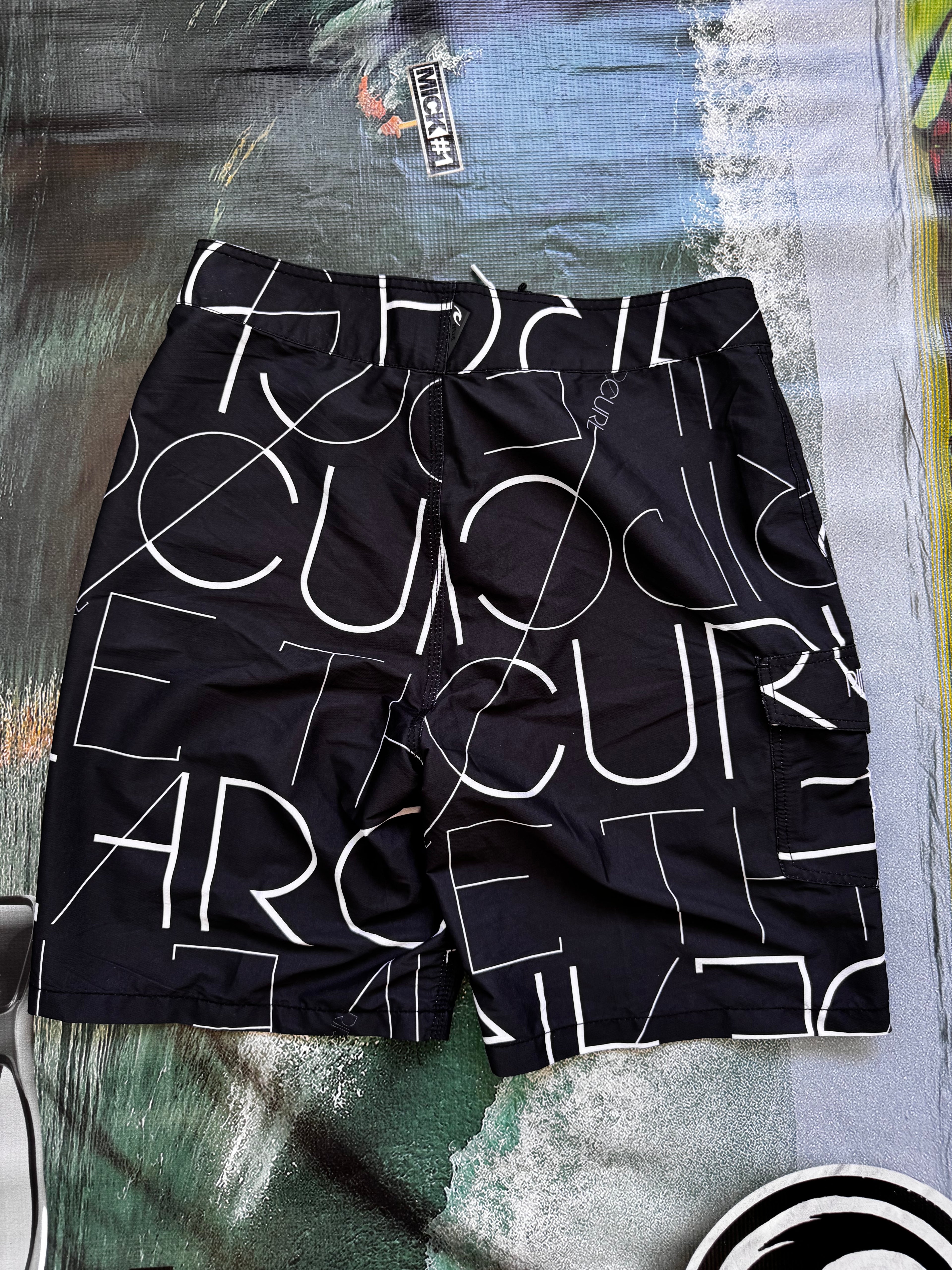 Vintage Y2K Rip Curl boardshorts, logo detail