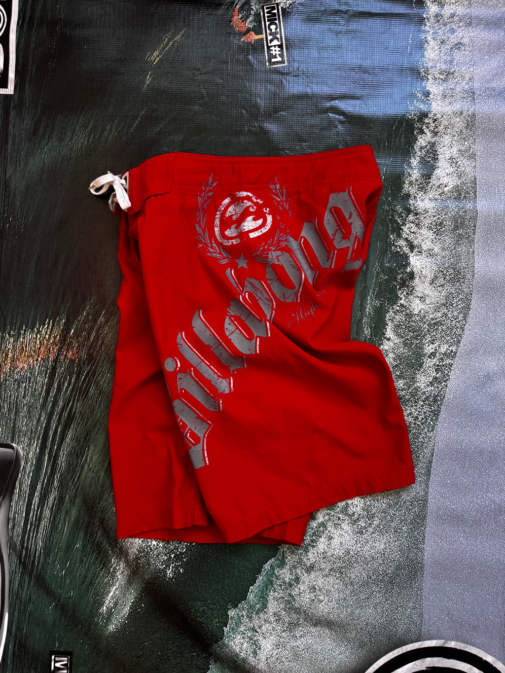 Vintage Y2K Billabong boardshorts in red, back view