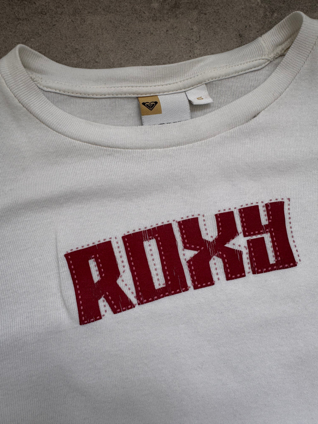 Vintage Y2K Roxy baby tee in white, back view