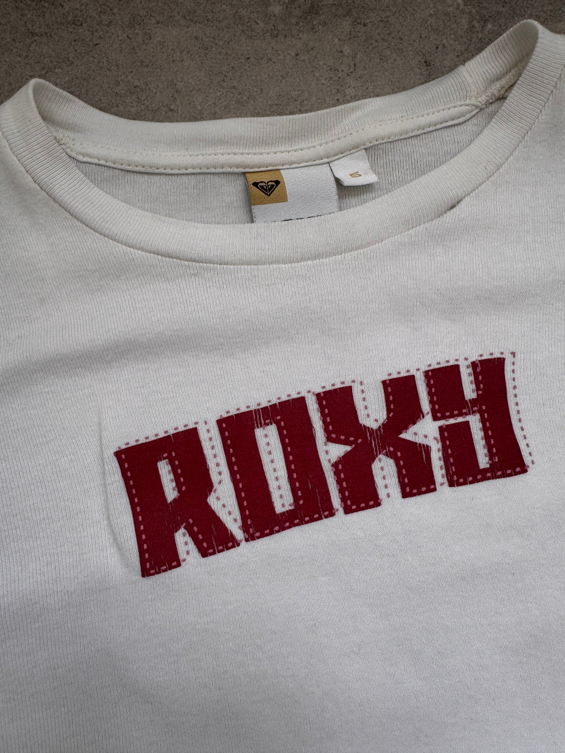 Vintage Y2K Roxy baby tee in white, back view