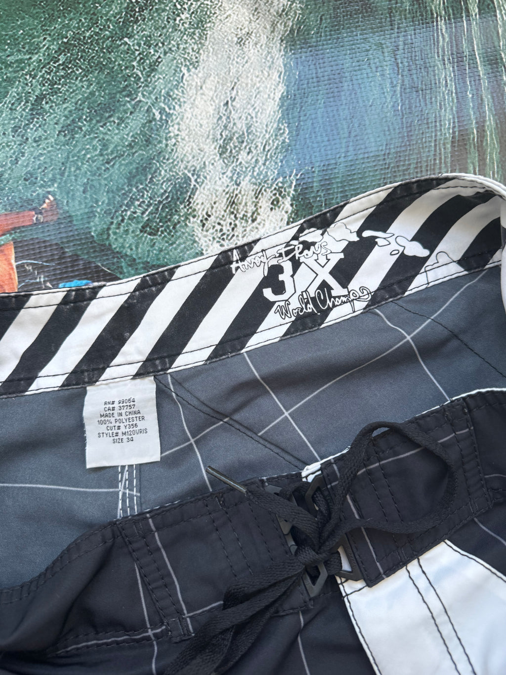 Y2K Andy Irons Rising Sun boardshorts in black and white, size 34, Billabong grail - detail view