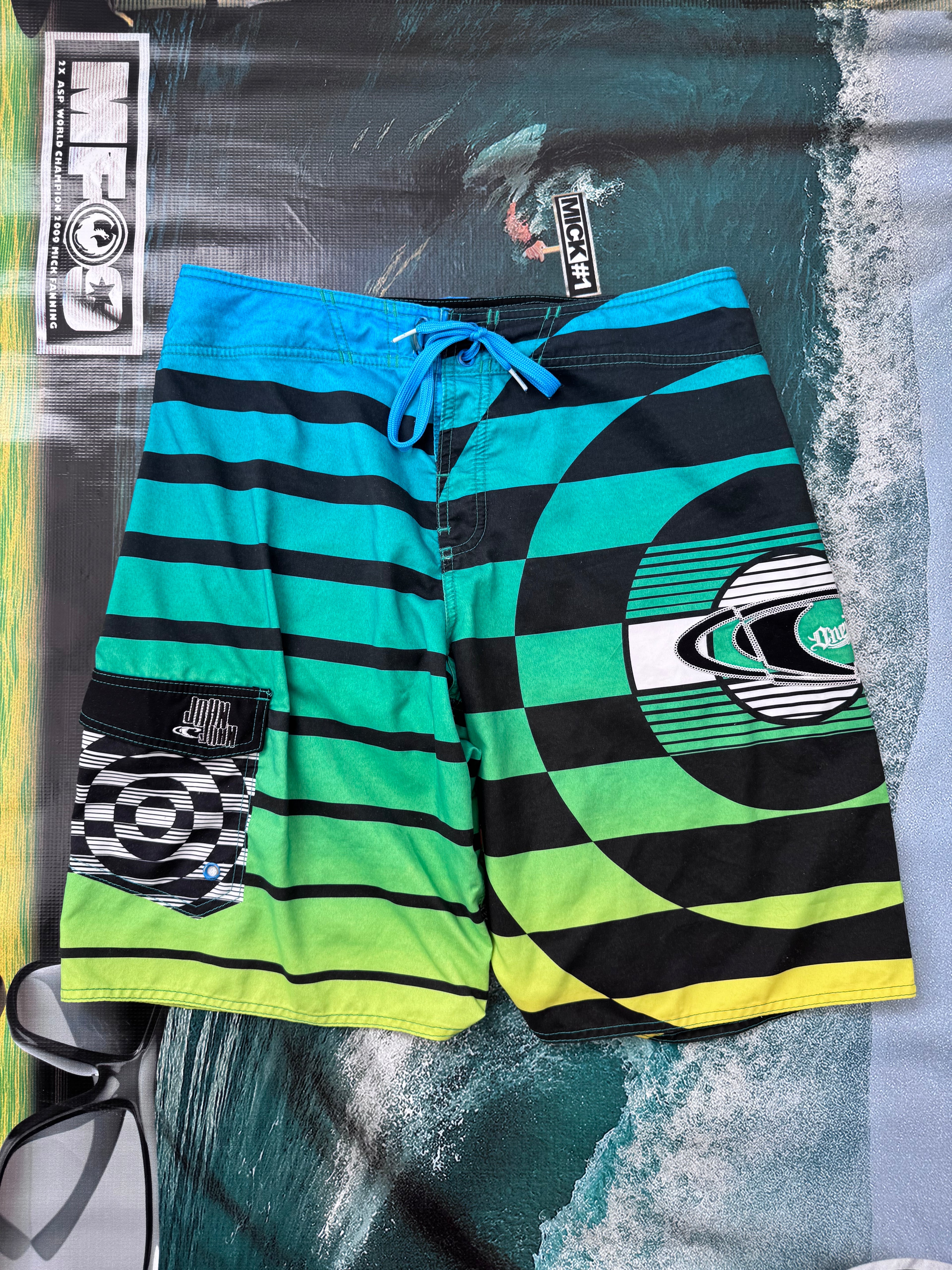 Y2K O'Neill John John Florence boardshorts blue/green/black size 33 – front view