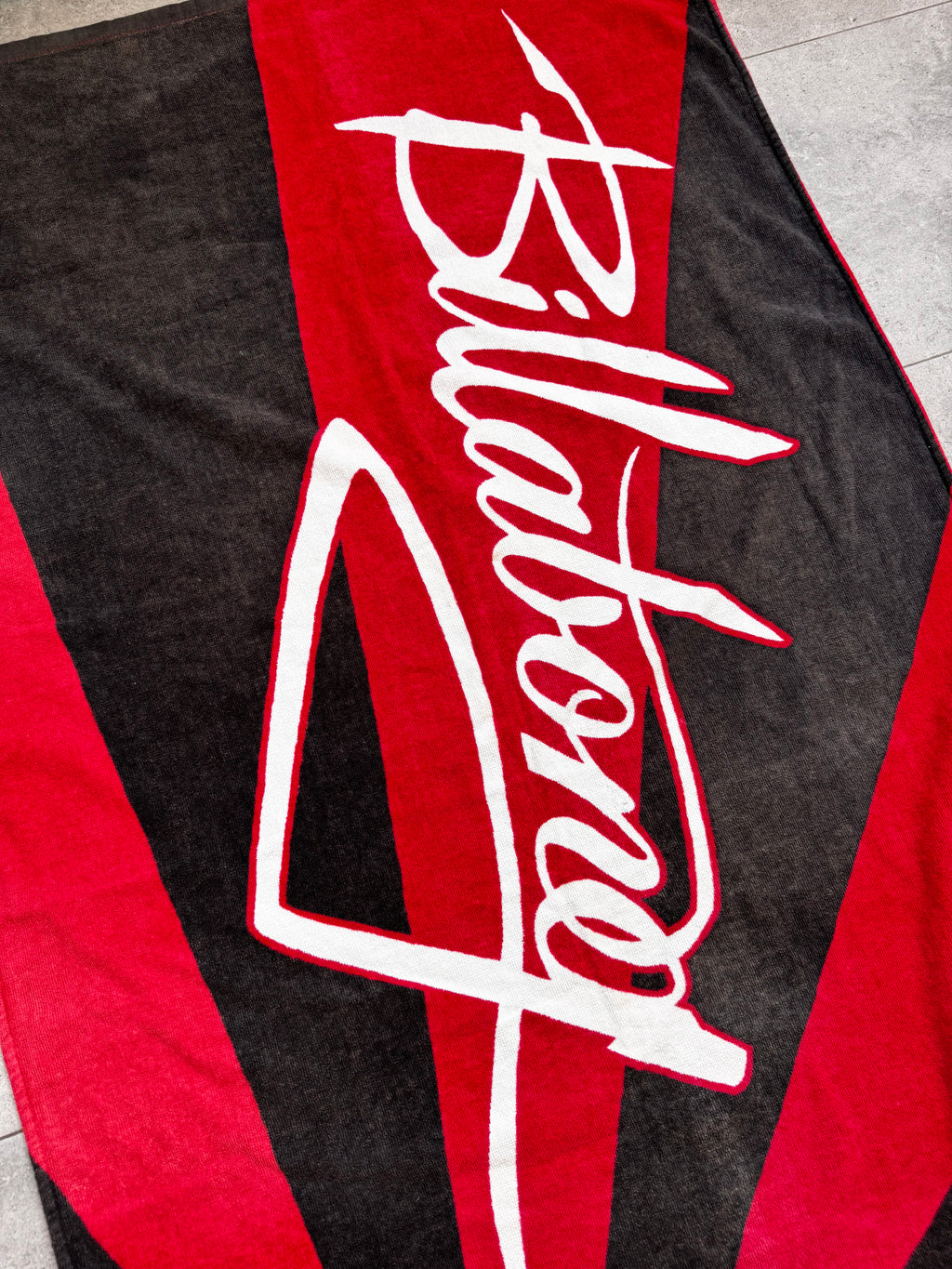 Vintage Y2K Billabong Rising Sun beach towel, folded view